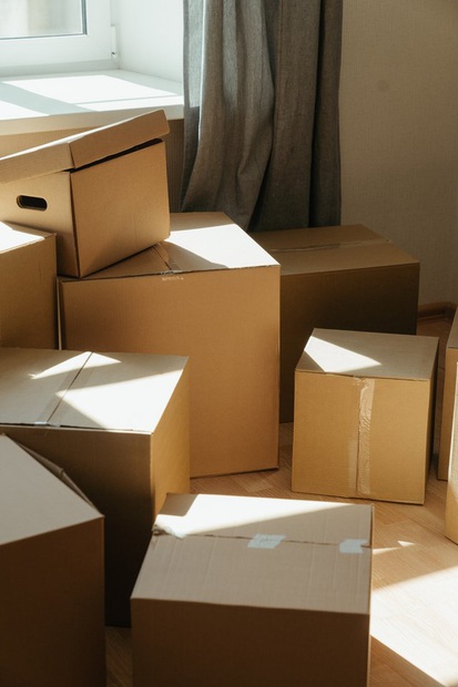 Moving boxes in an empty home representing move-in and move-out cleaning services