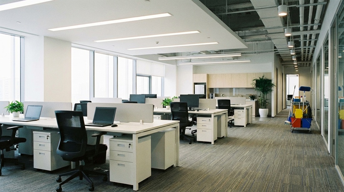 Tidy modern office space with vacuumed floors and organized desks.