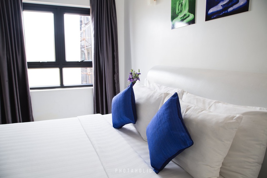 Bright, freshly cleaned bedroom representing recurring house cleaning service
